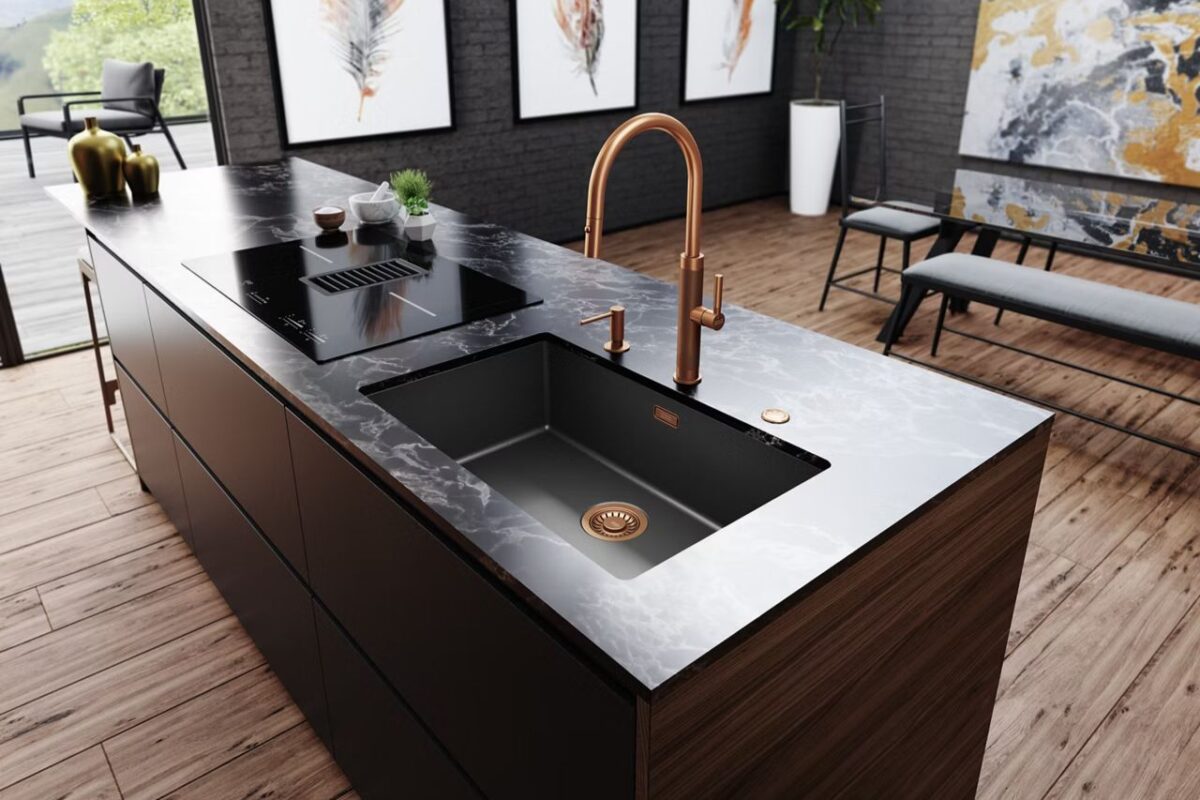 A large kitchen island with a tap and sink from Franke