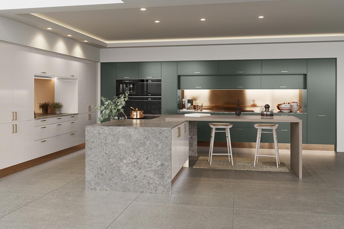 An elegant modern kitchen with a spacious island and built-in appliances. The space is adorned with two bespoke cabinetry in white and green finishes from Masterclass Kitchens.
