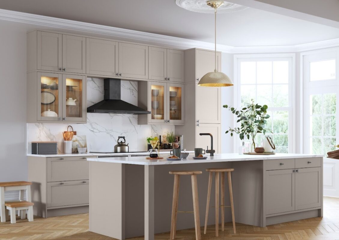 A modern kitchen installation which features bespoke cabinetry and a central island with ample storage.